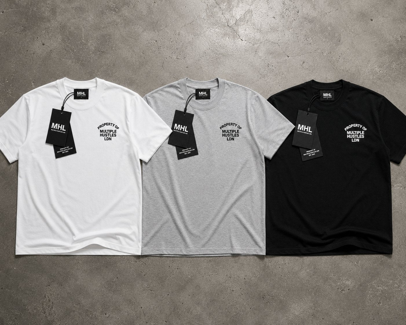 Property Of MHL tees laid out in white, grey marl and black with MHL hangtags